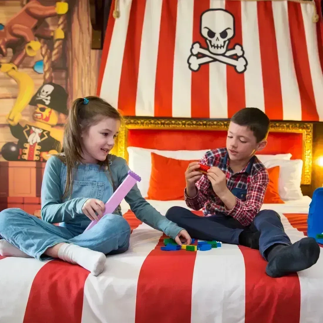 Kids playing with LEGO in a Pirate Room at the LEGOLAND Resort Hotel
